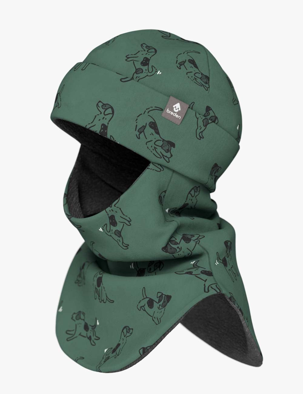 a soft green kids balaclava with playful dog patterns, shown in gentle morning light