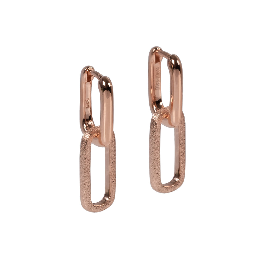 bold metropolitan earrings in dramatic studio lighting showcasing their 925 silver and rhodium finish