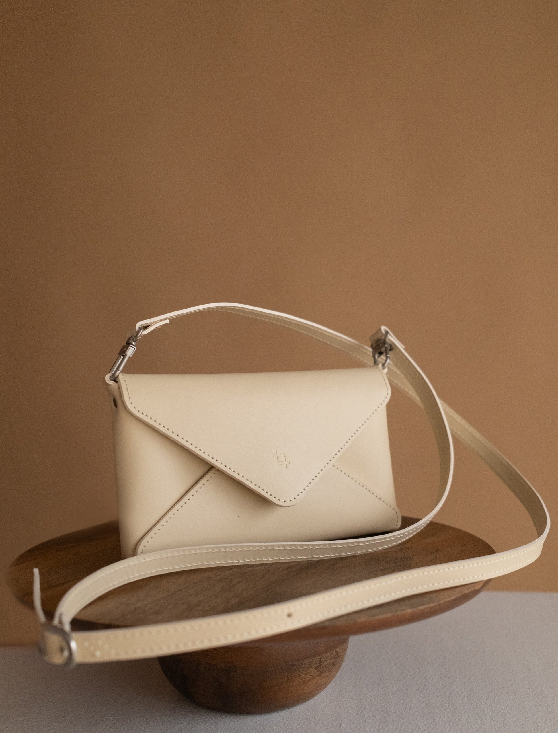 bold close-up of the chic cookie clutch with its three versatile straps laid out confidently