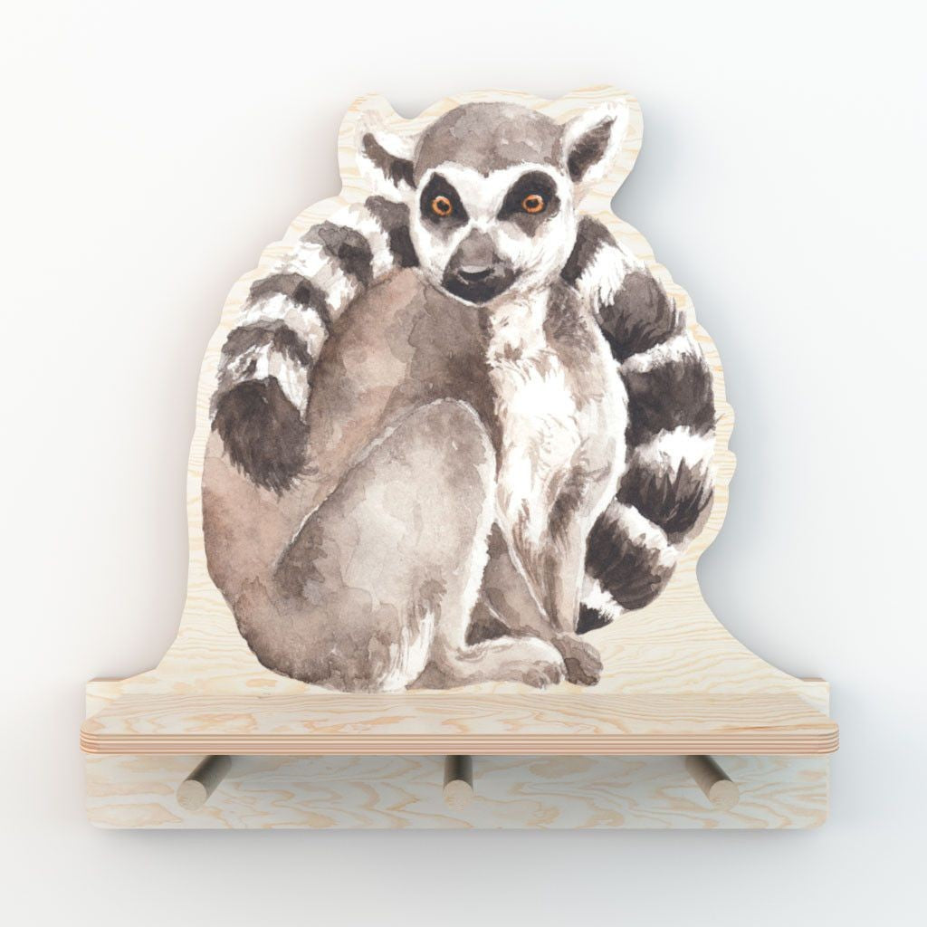 bold lemur wall shelf with three pegs for hanging keys and bags in a bright room
