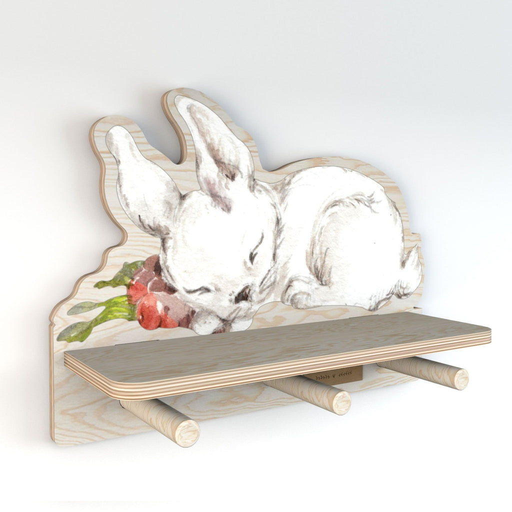 bold rabbit wall shelf with three pegs for hanging jewelry and keys in a modern kids room