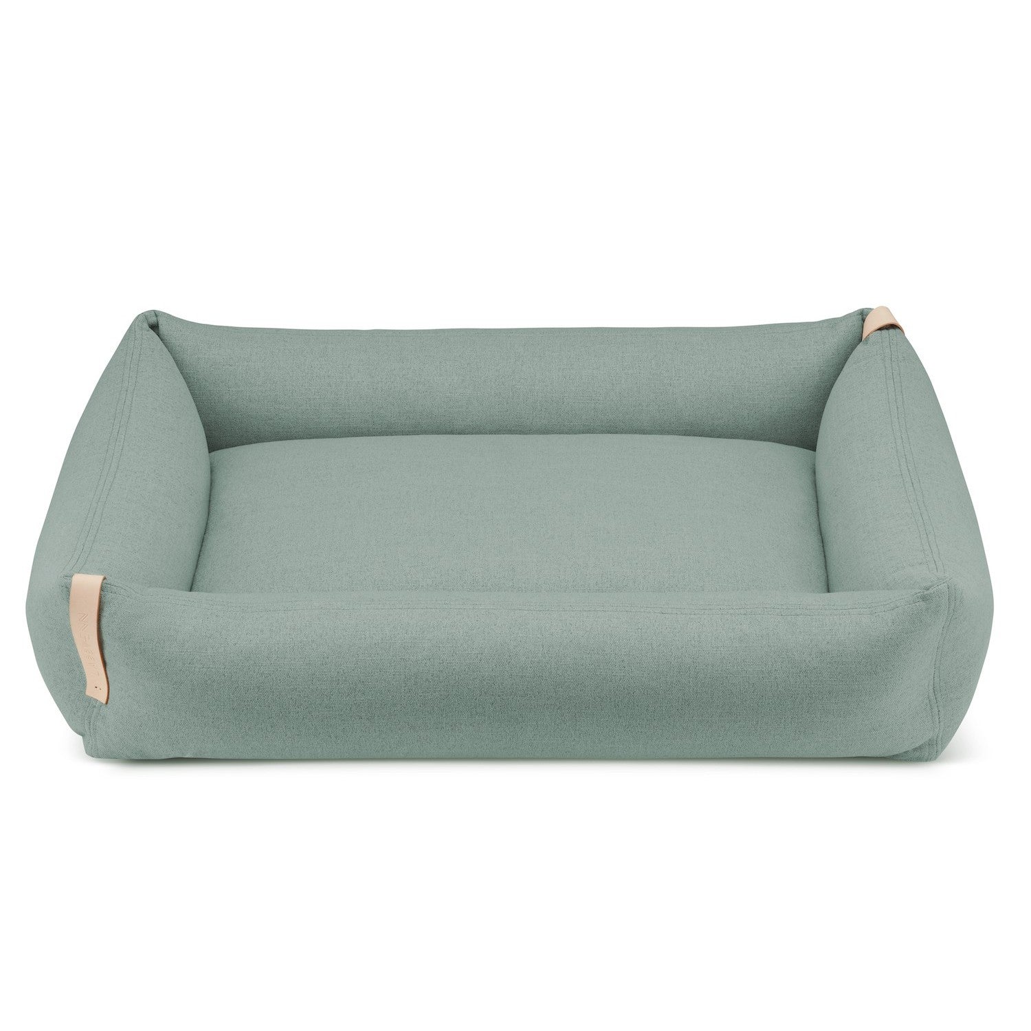 bold teal moe dog bed with natural leather belt in modern living room