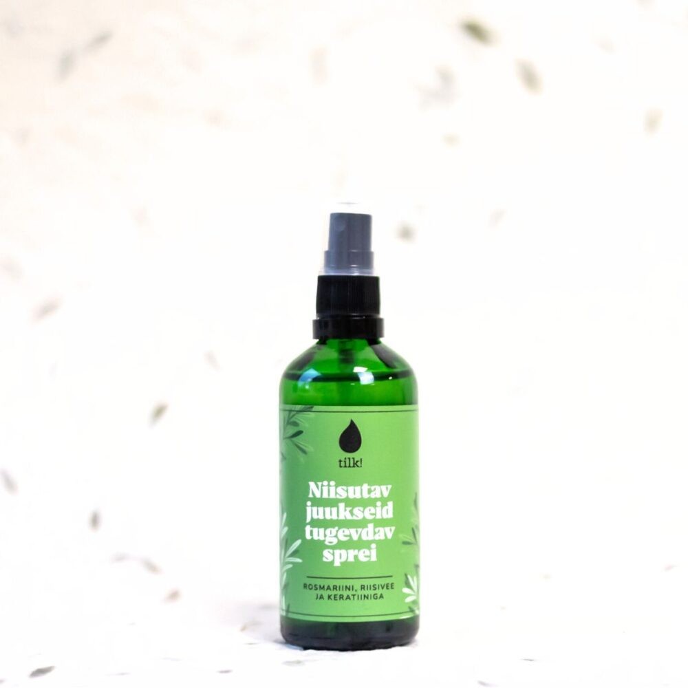 a gentle mist of vegan hair spray with rosemary and rice water, glowing softly in morning light