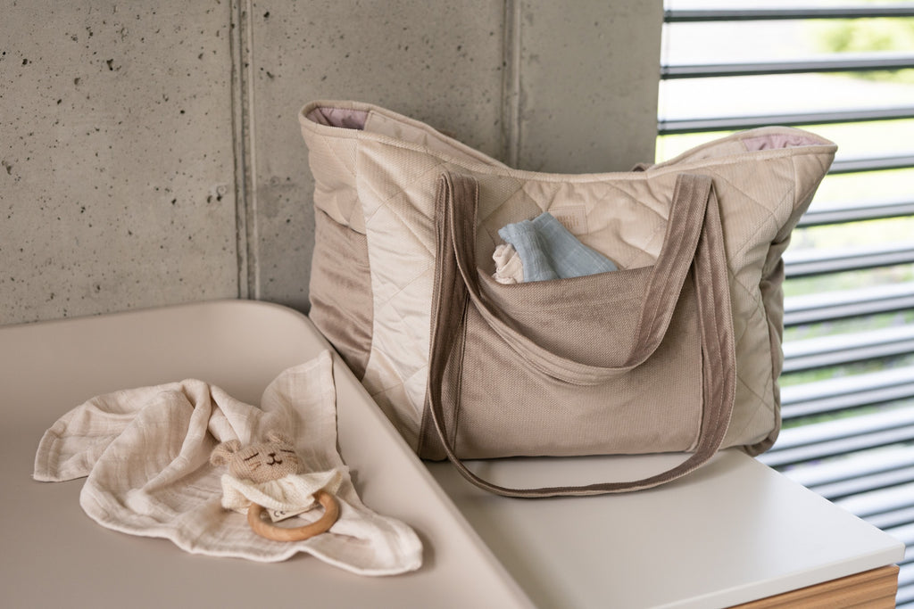 bold beige weekender bag with elegant velvet texture and multiple pockets for organized travel