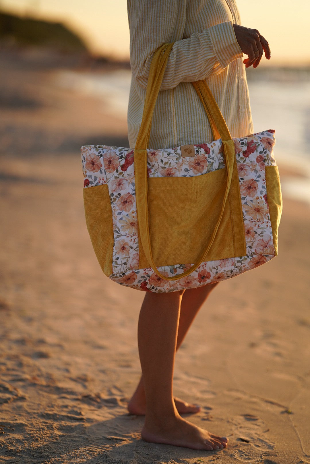 elegant handmade velvet weekender bag with floral print, open to show its spacious waterproof interior and multiple pockets