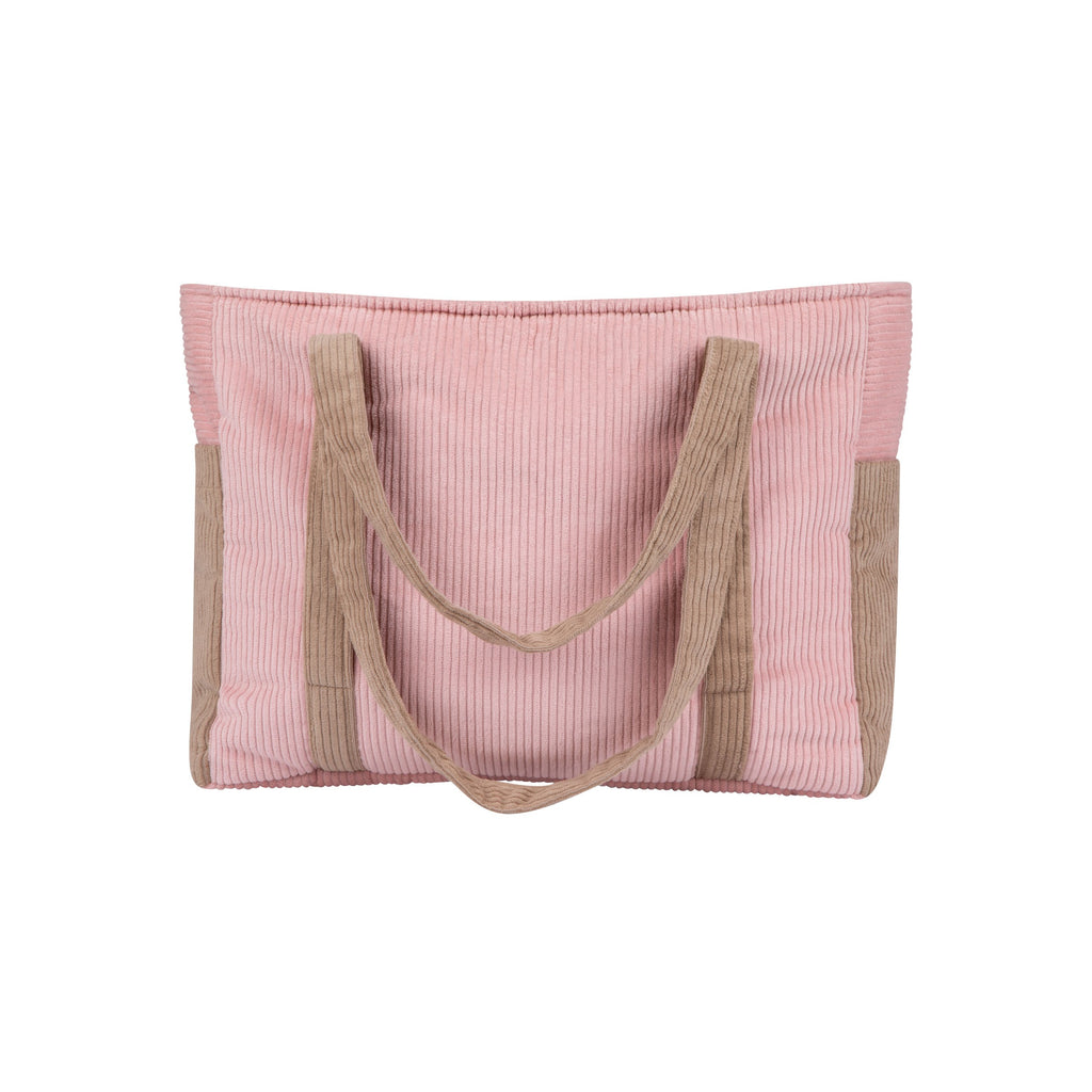 pink velvet weekender bag on a park bench, showing its spacious interior and multiple pockets