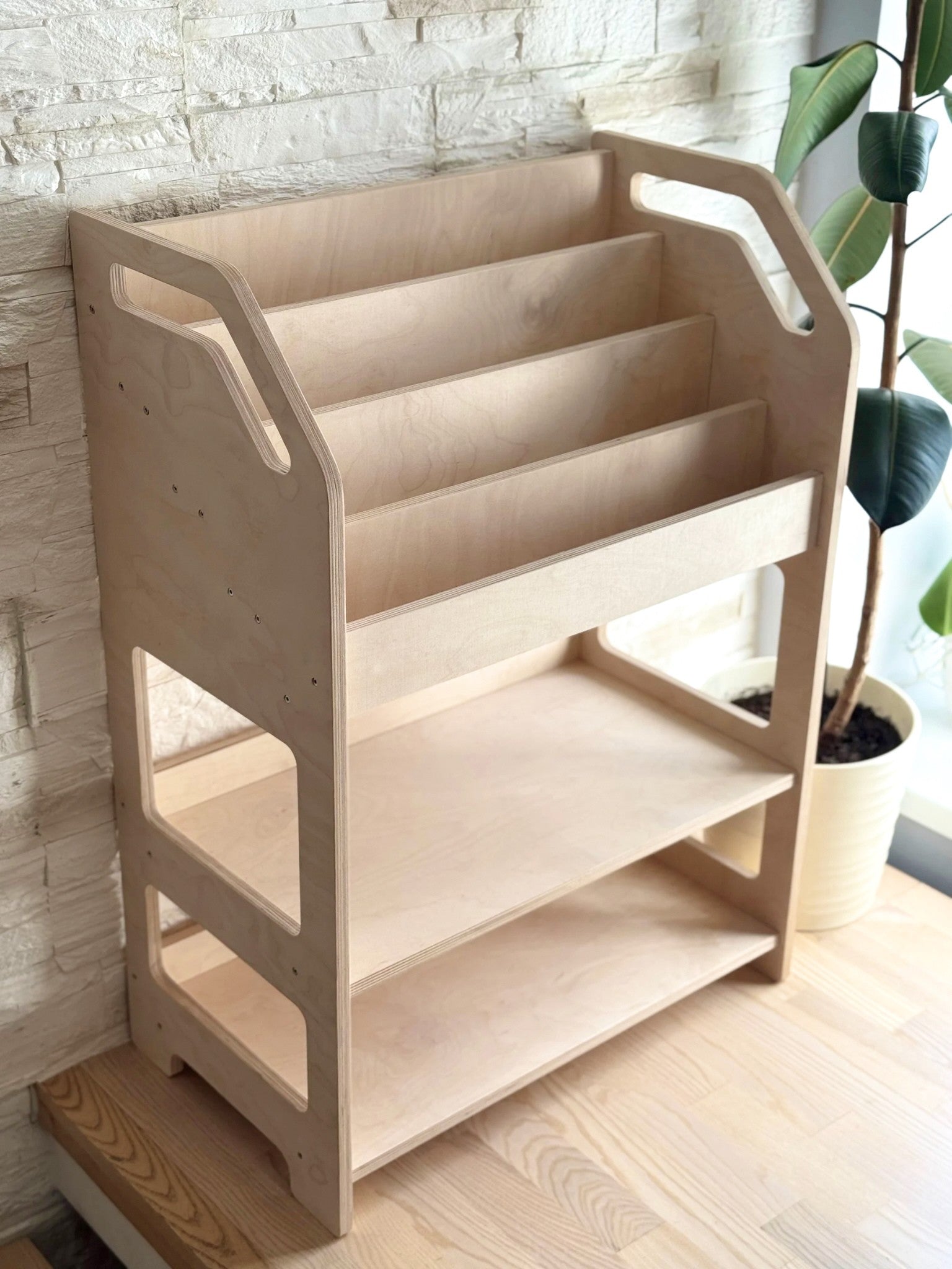 elegant birch bookshelf in a minimalist nursery with soft morning light