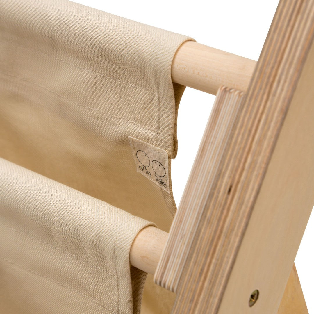 elegant montessori bookshelf leaning against a wall in soft morning light