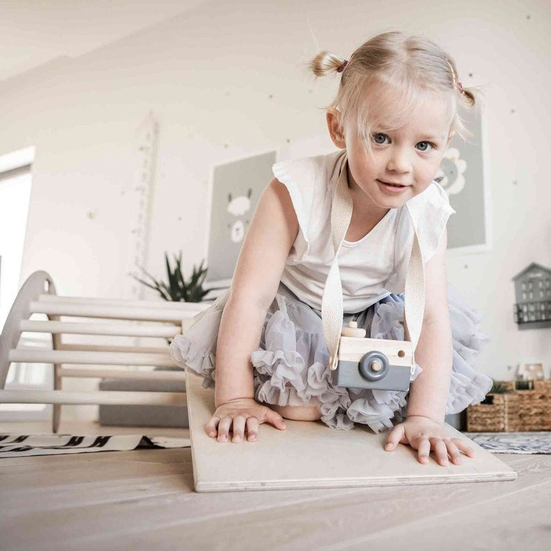 elegant baltic birch climbing arch in a minimalist playroom setting
