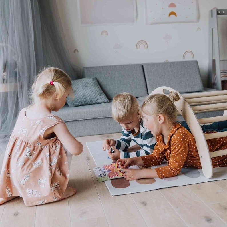 montessori climbing arch and ramp setup in a bright playroom, showing practical use for active indoor play