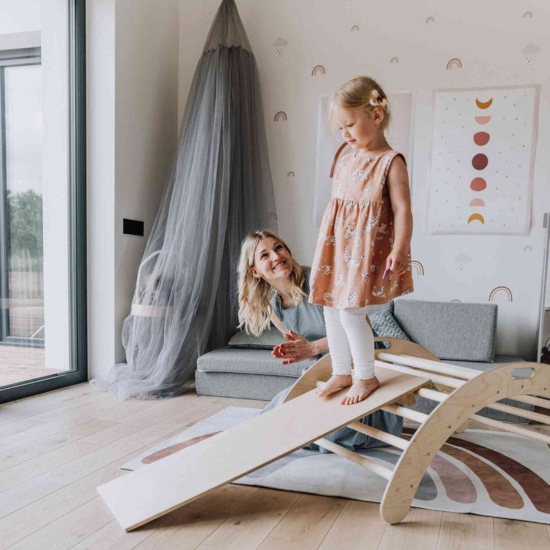 elegant montessori climbing arch and ramp in a minimalist, sunlit playroom setting