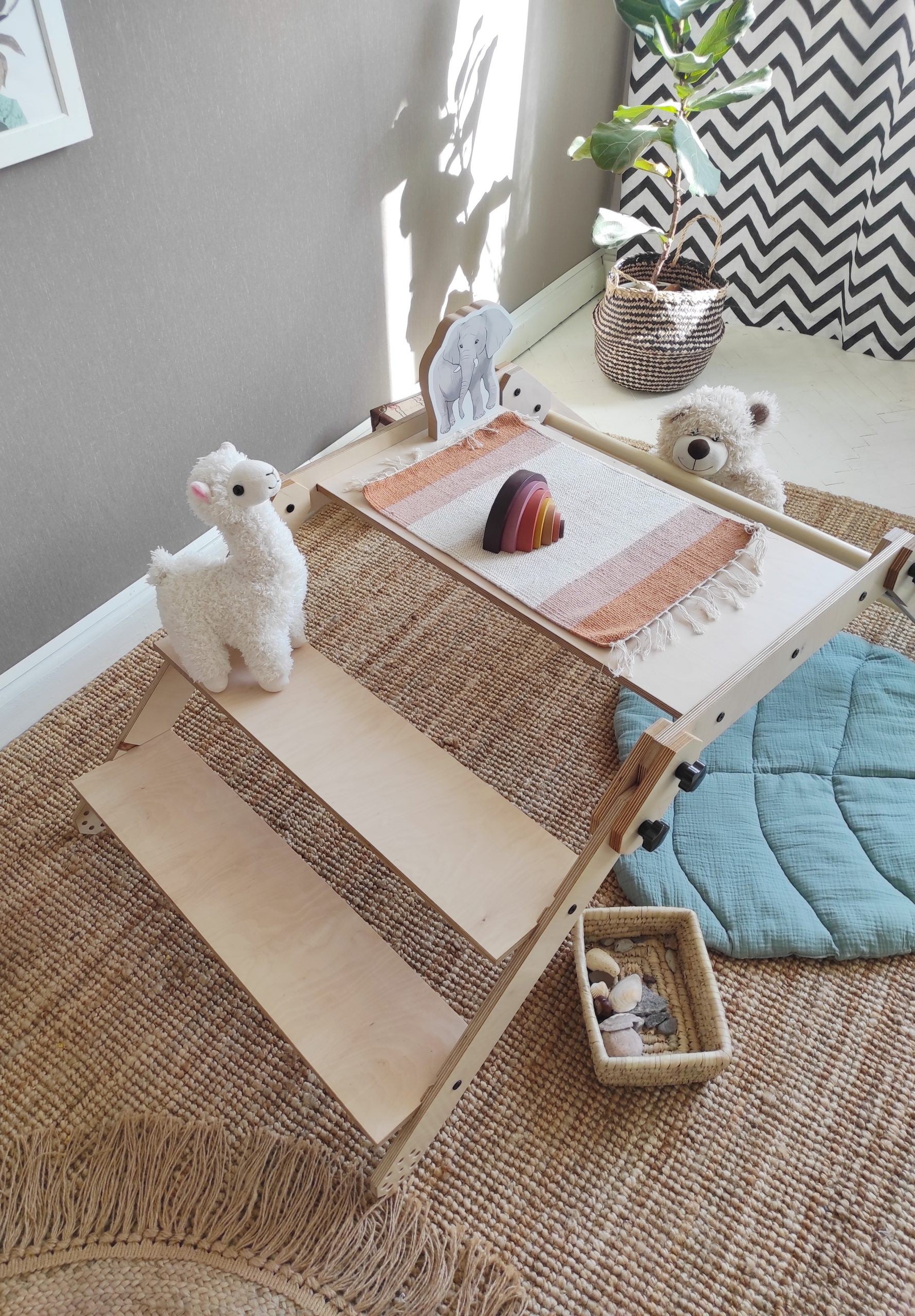 elegant white nabu montessori set configured as a chic drawing table in a modern nursery
