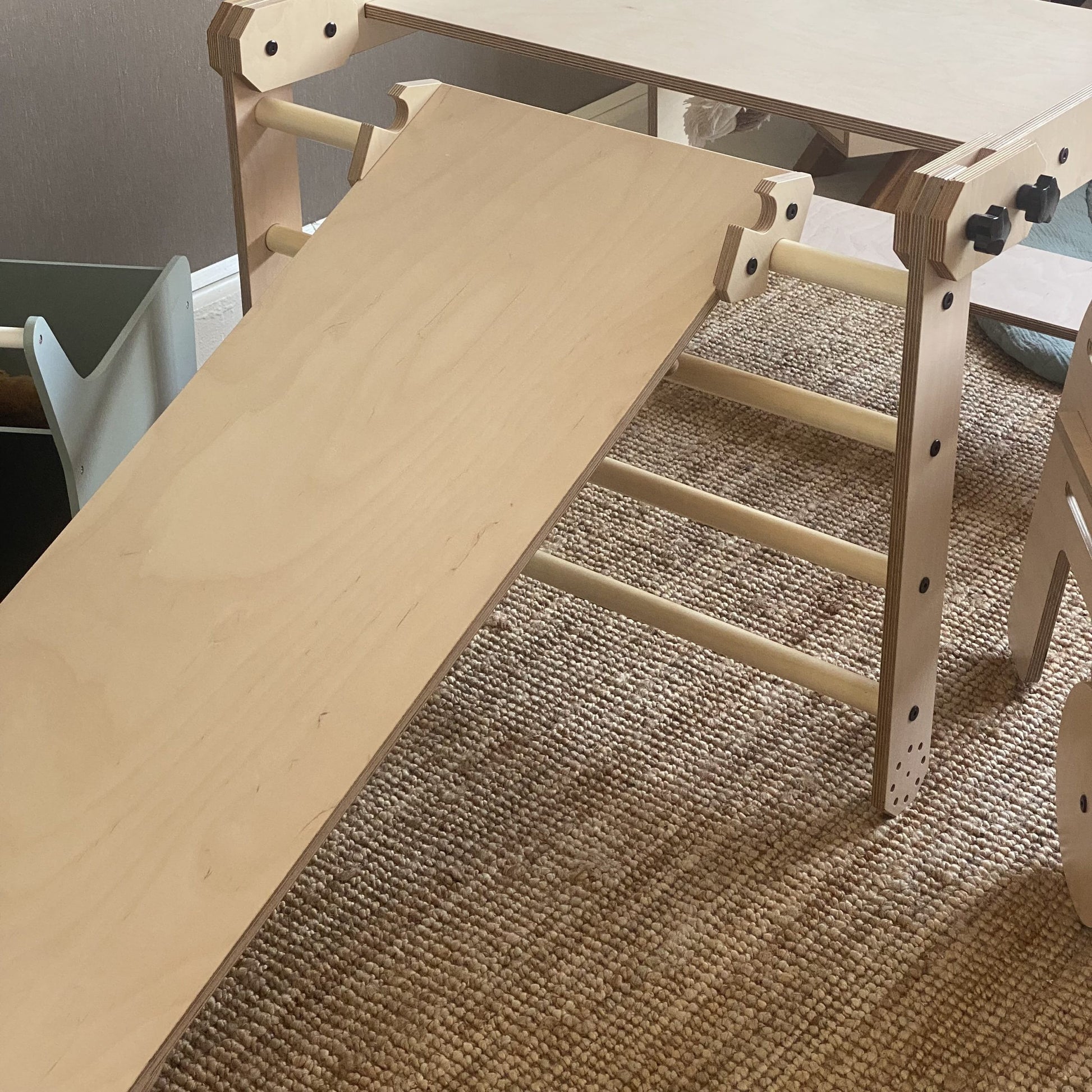 montessori nabu set with whiteboard tabletop and optional slide in a bright, open playroom