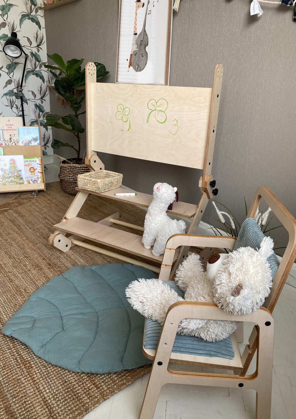 a child drawing on the nabu set's whiteboard tabletop during a cozy indoor play session