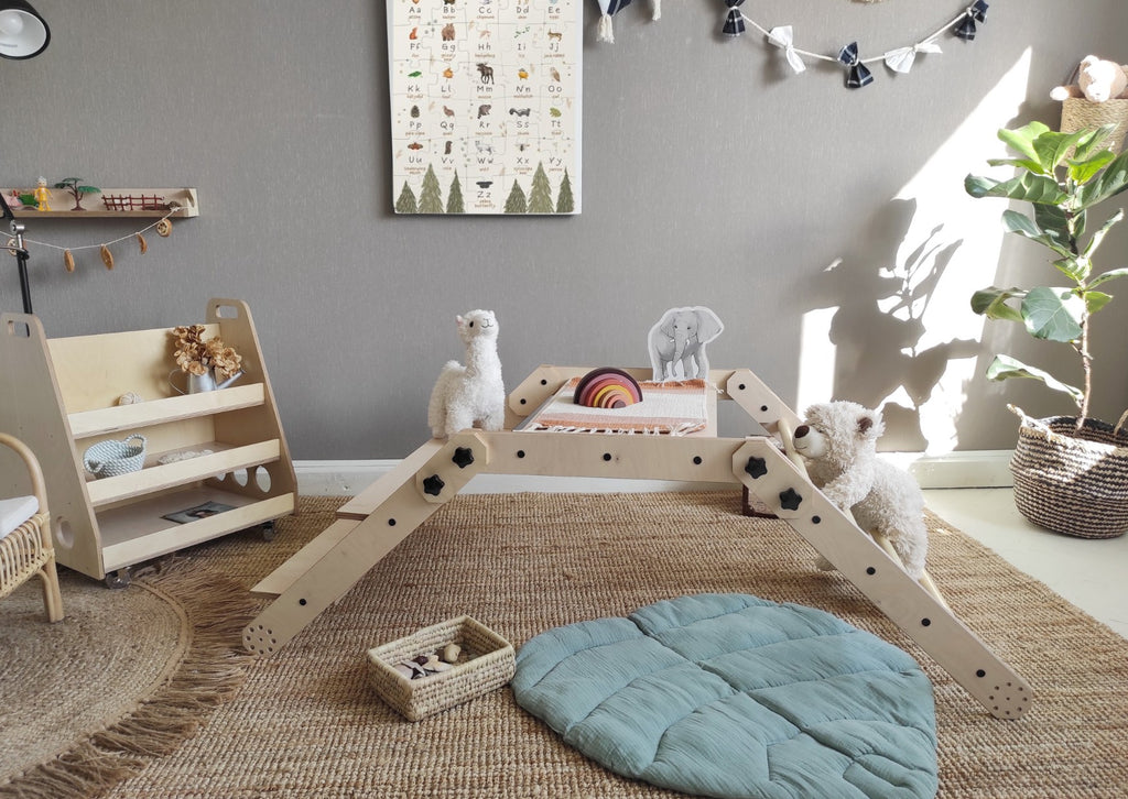 bold front view of the montessori nabu climbing set in a bright, modern playroom
