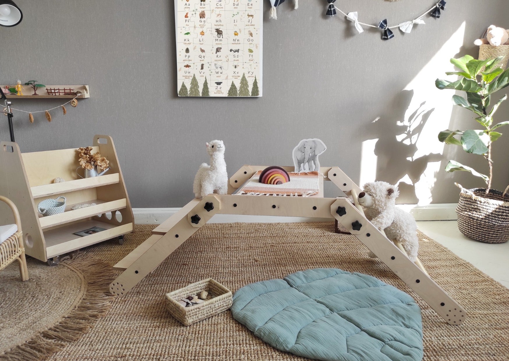 bold front view of the montessori nabu climbing set in a bright, modern playroom