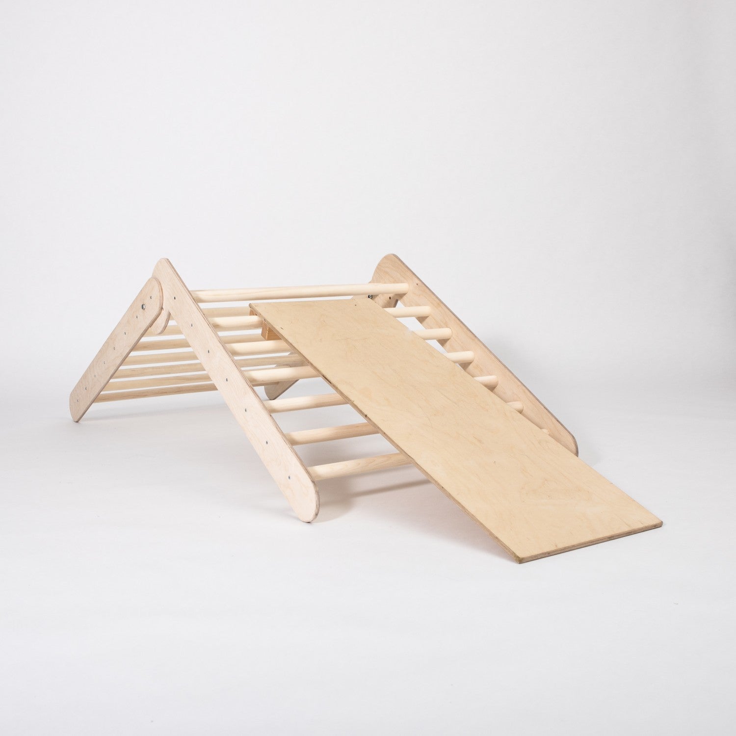 foldable montessori climbing triangle with ramp in use, showing sturdy birch plywood construction and safe toddler play
