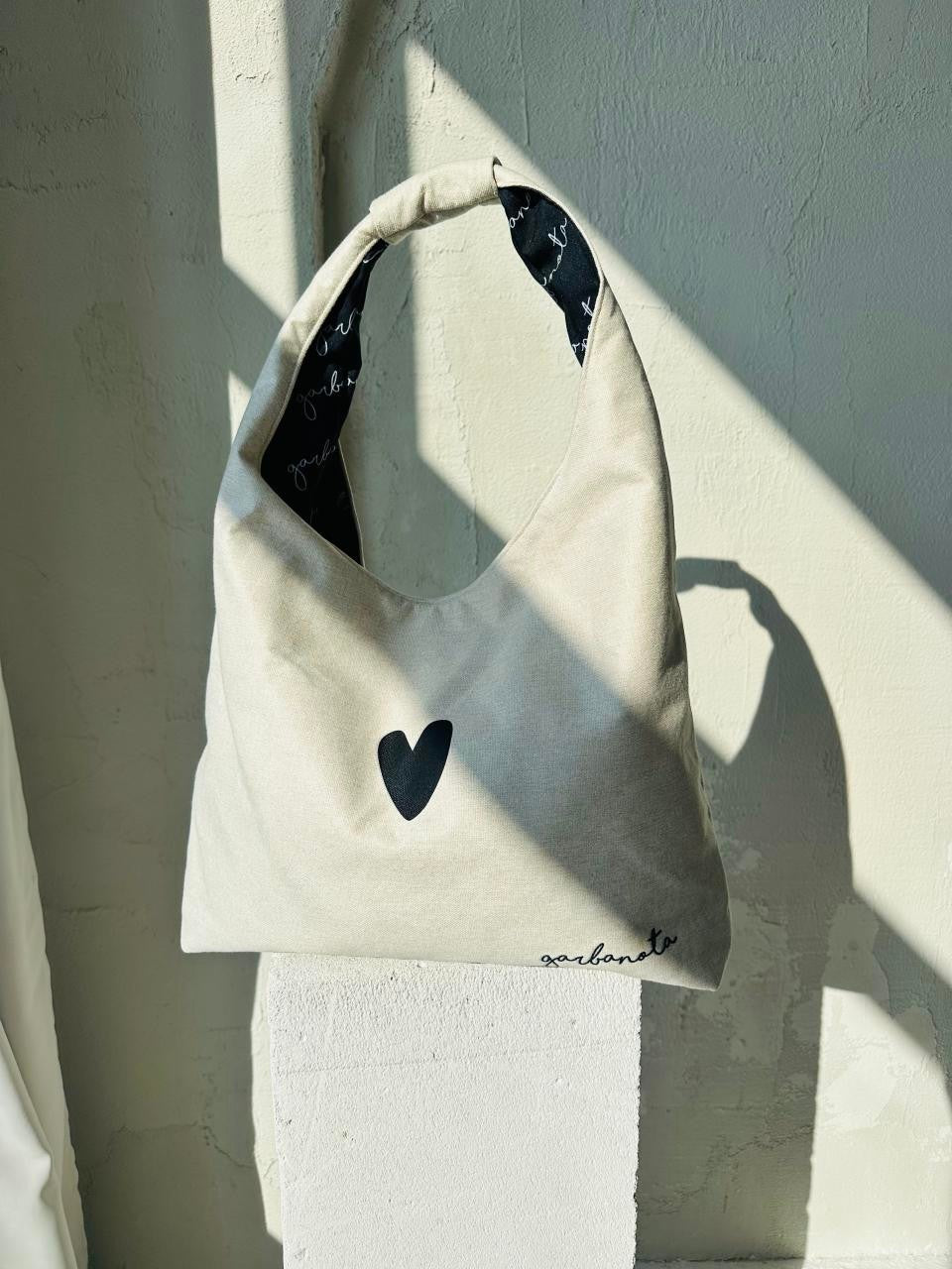 elegant white moon bag heart with chic garbanota lining, captured in soft morning light