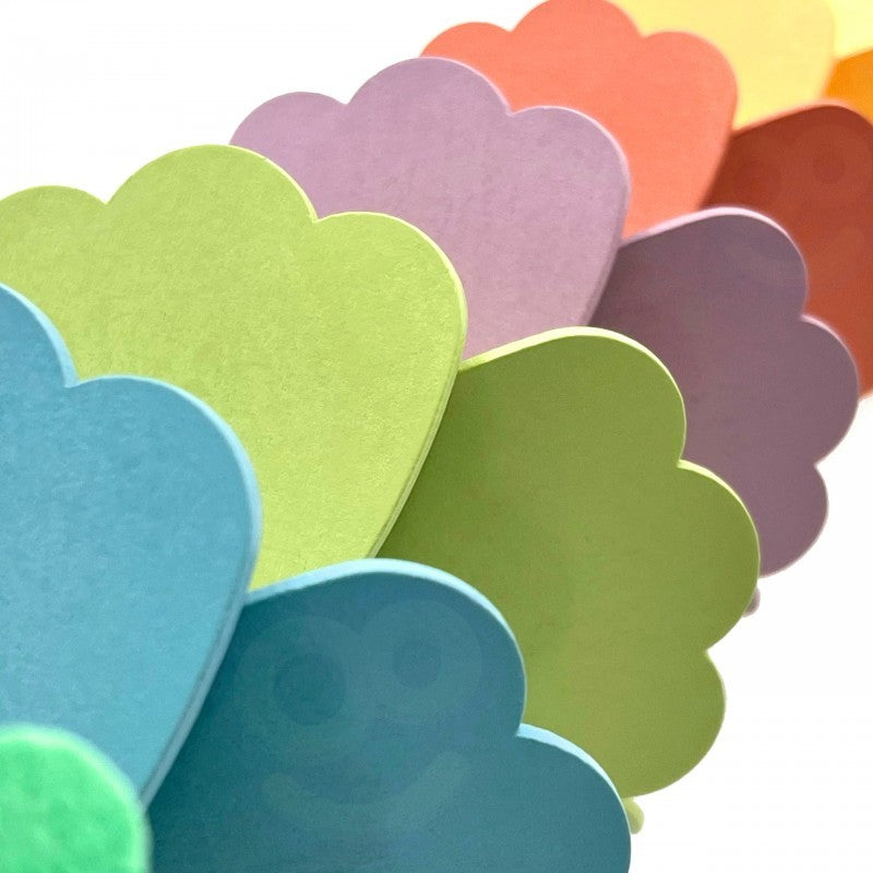 close-up of a colorful ball rolling down the musical rainbow track with soft focus