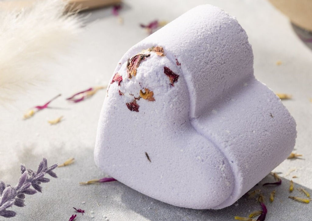 elegant gift set of five handmade lavender heart shower steamers on a marble surface