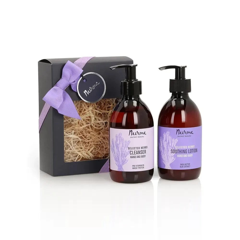 softly lit lavender gift set with ribbon on a rustic wooden table