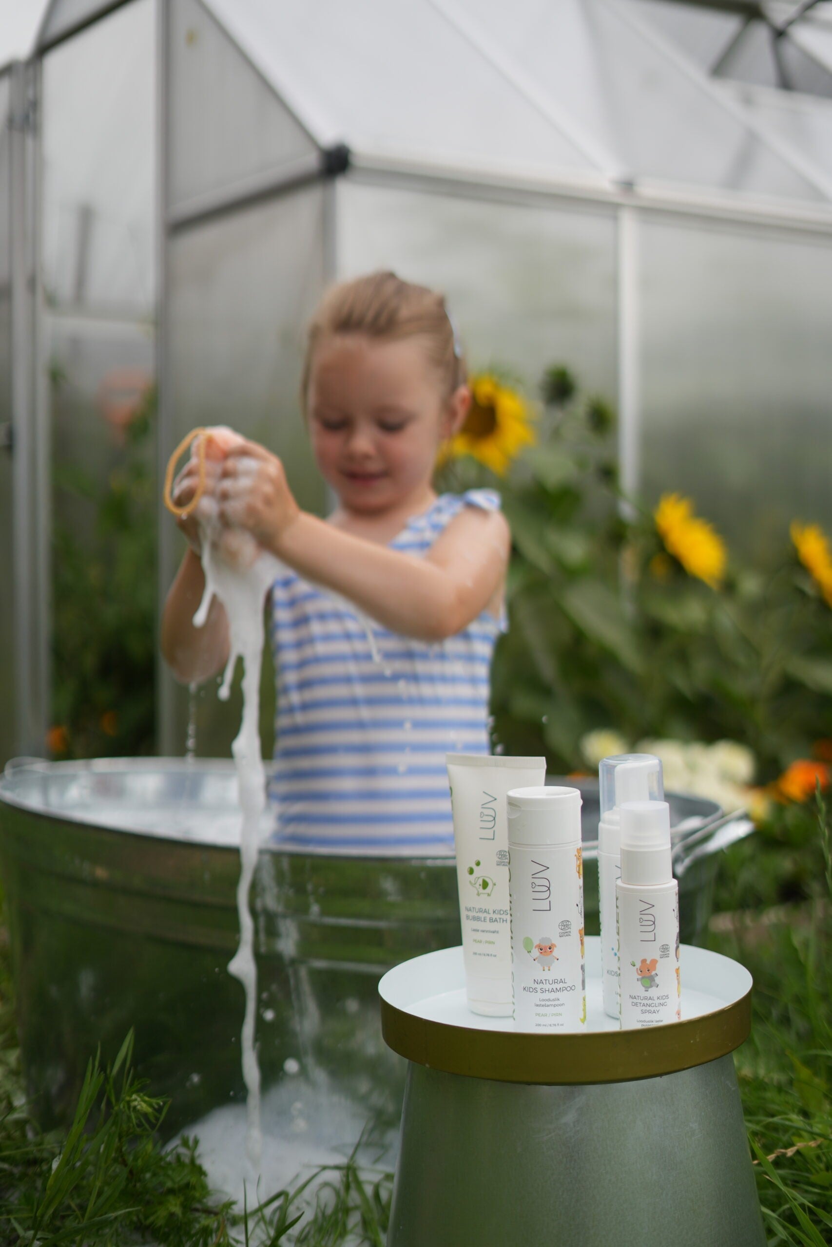 luuv natural pear kids shampoo bottle with gentle morning light on a soft nursery shelf