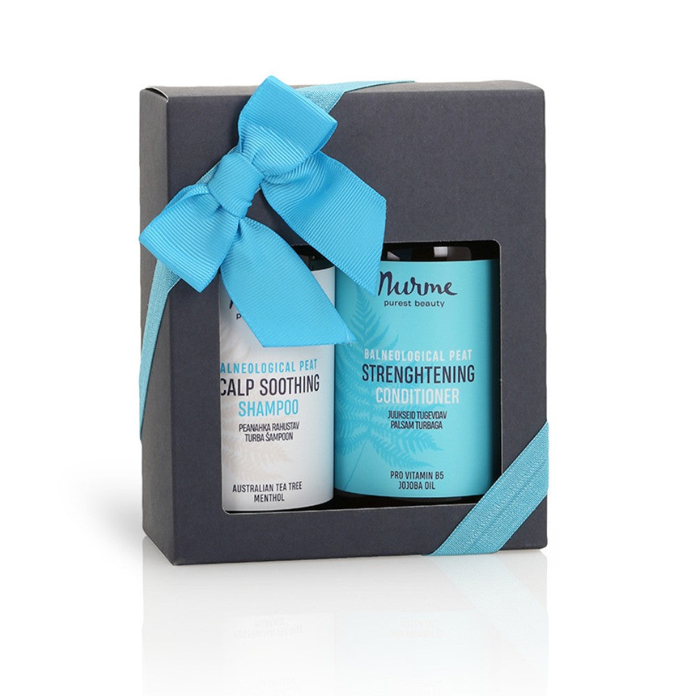 playful gift set for sensitive scalps with peat shampoo and conditioner on a sunny windowsill