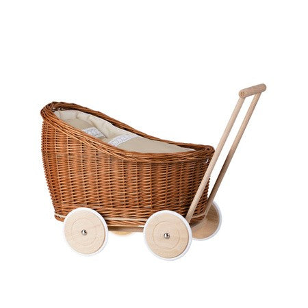 playful wicker doll pram with beige bedding in a sunlit nursery setting