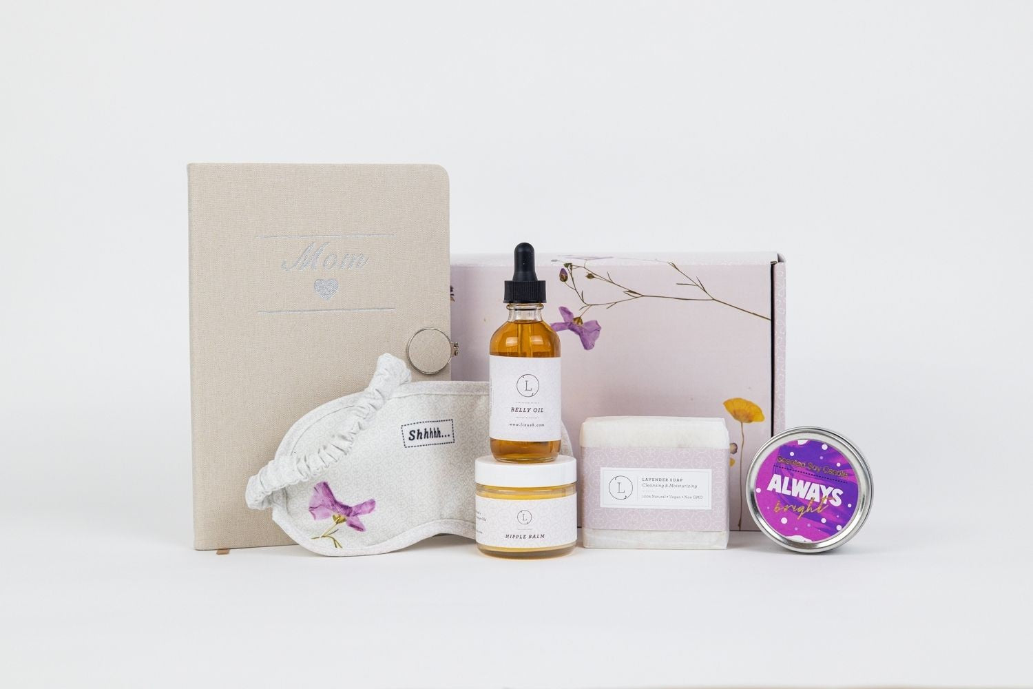 confident display of a thoughtful mom-to-be gift set with balm, candle, and journal