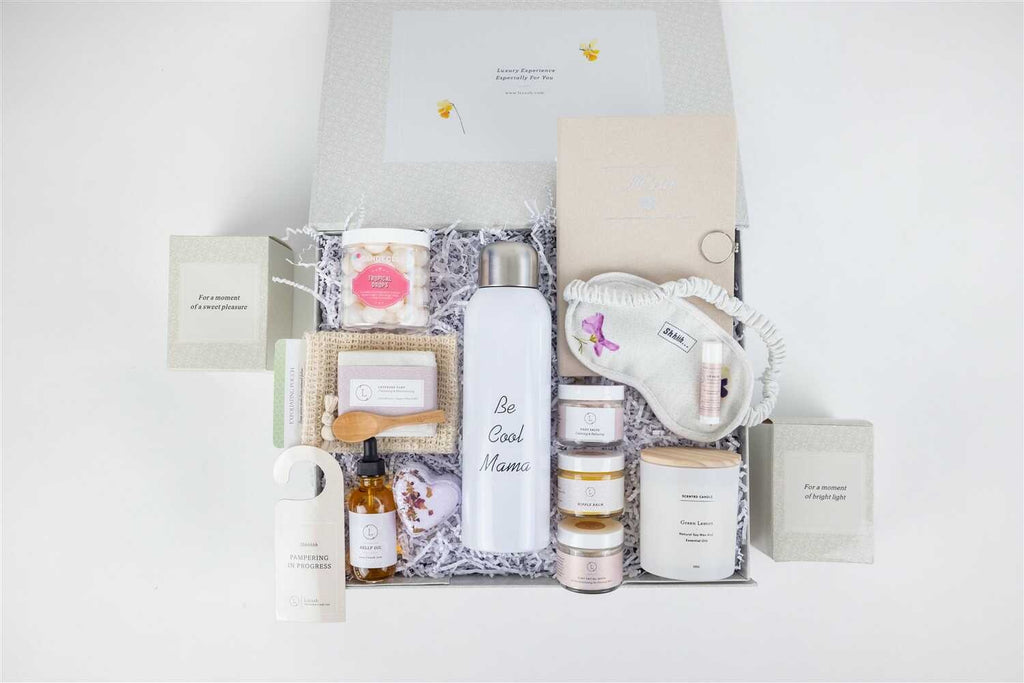 functional arrangement of mom skincare gift set with journal, water bottle, and practical self-care items