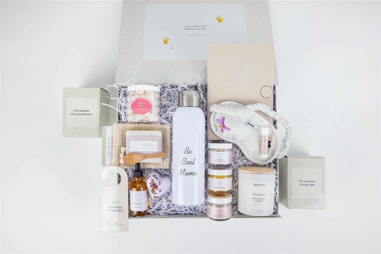 functional arrangement of mom skincare gift set with journal, water bottle, and practical self-care items