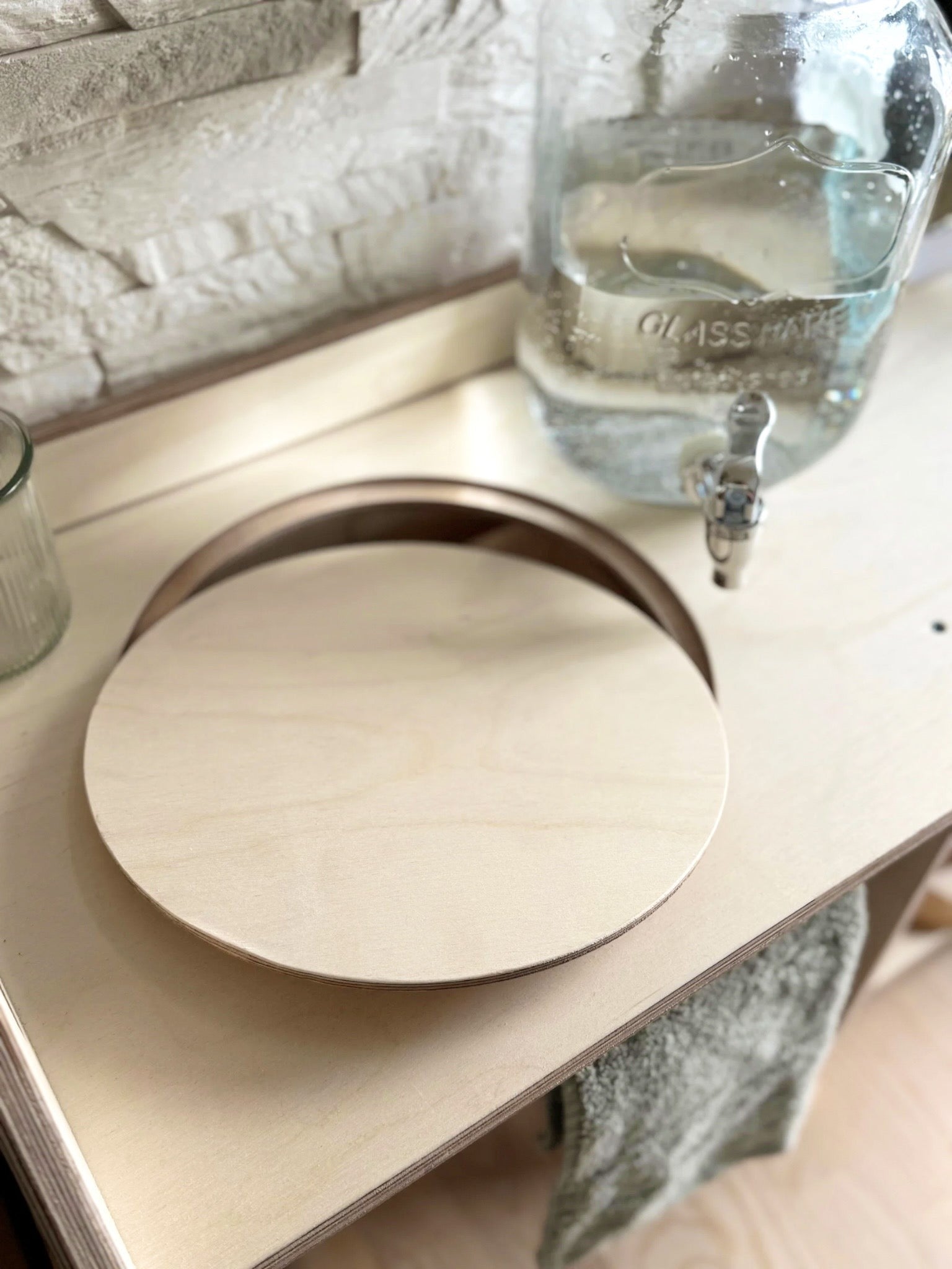 montessori wooden washbasin with storage in a bright, minimalist room setting