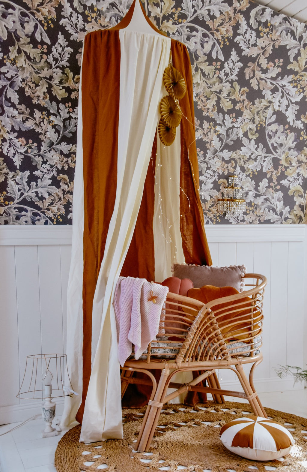bold caramel circus canopy draped over a bed, organic cotton-linen blend glowing in warm light
