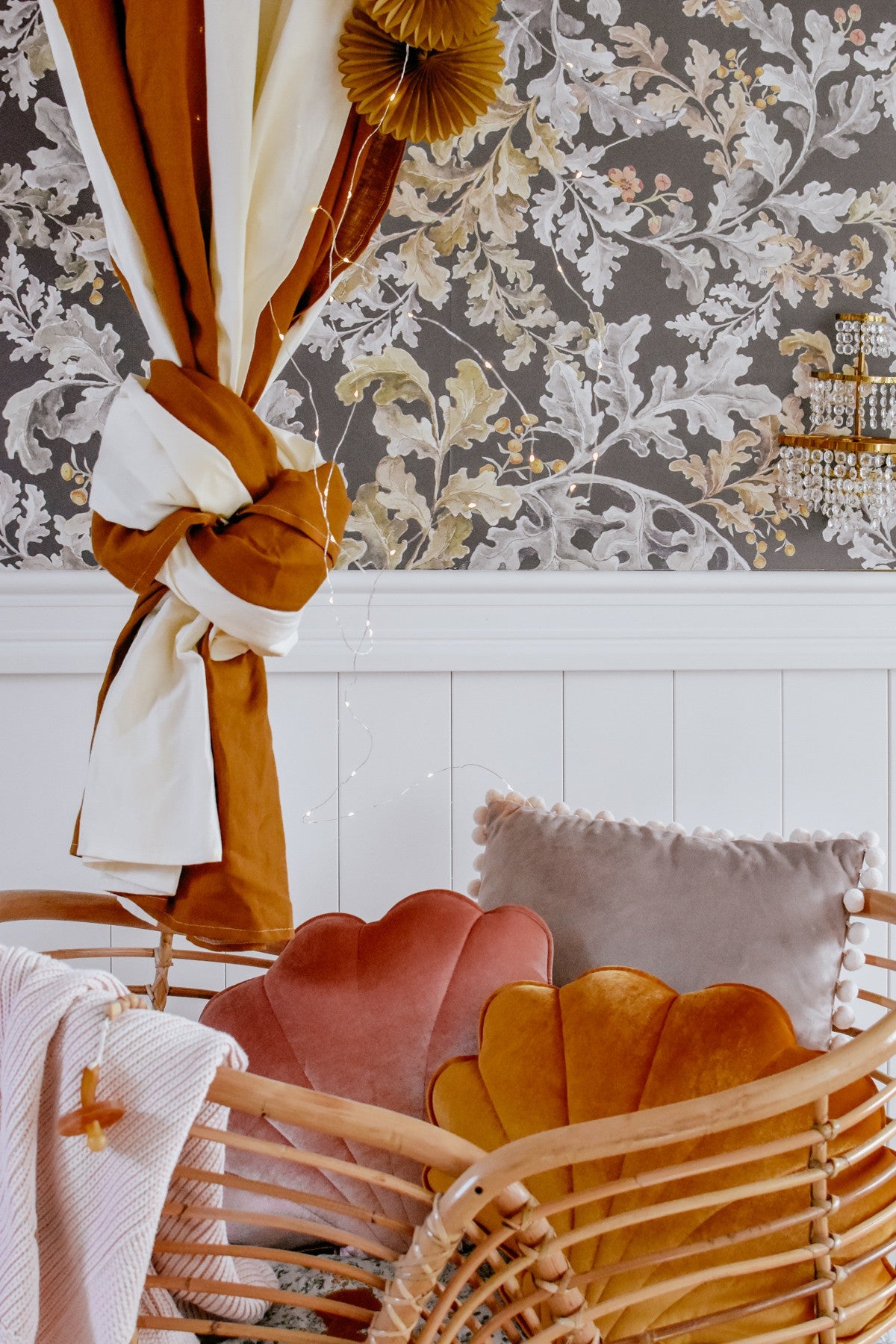 caramel circus organic cotton and linen canopy draped gracefully over a bed, soft cream and caramel hues glowing in warm light