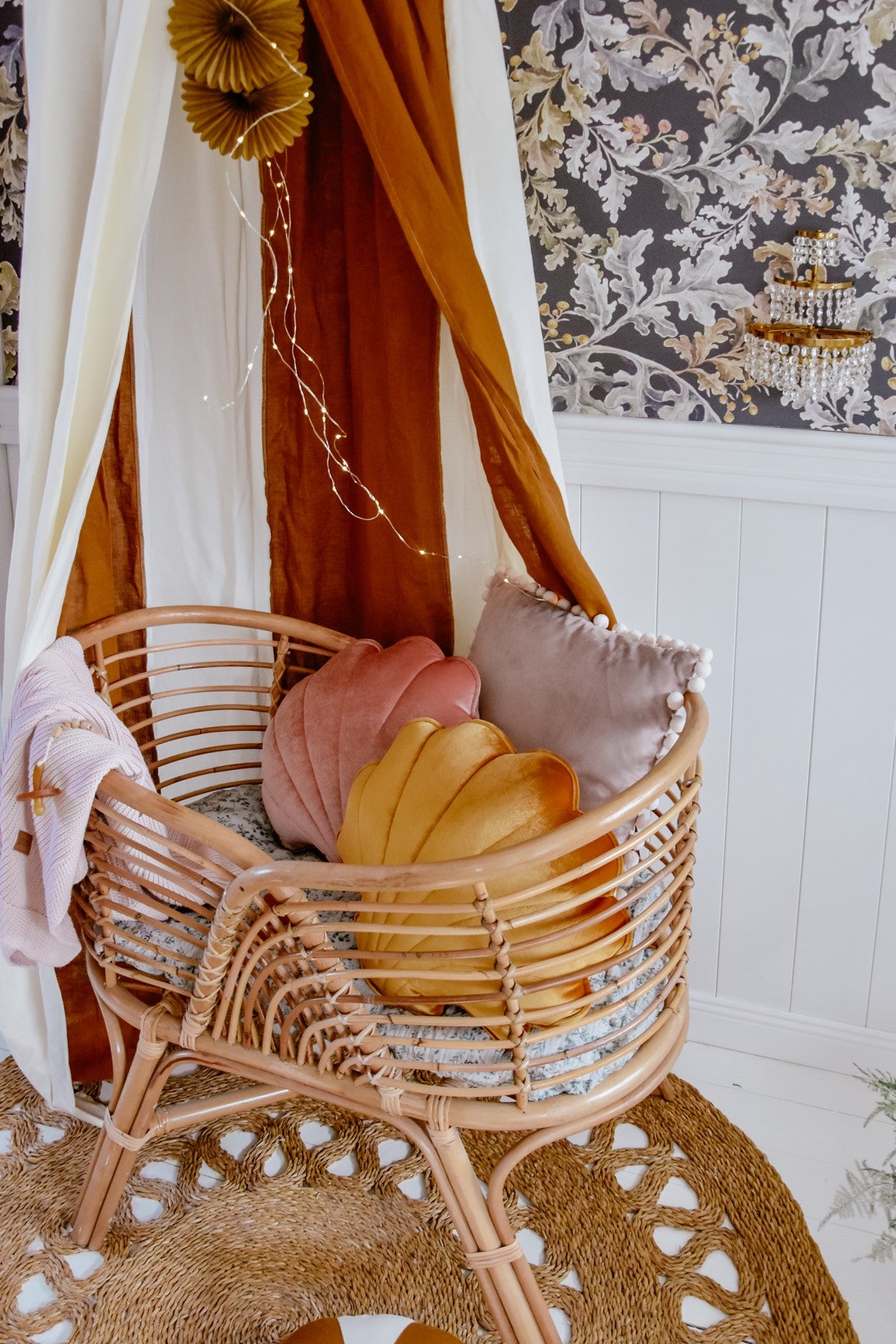 caramel circus organic cotton and linen canopy hanging over a cozy bed with soft golden lighting