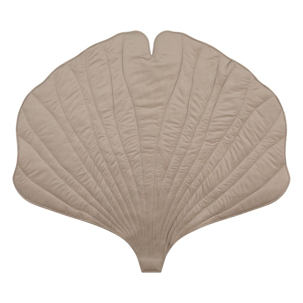 soft cream ginkgo leaf playmat in a cozy nursery corner with gentle morning light