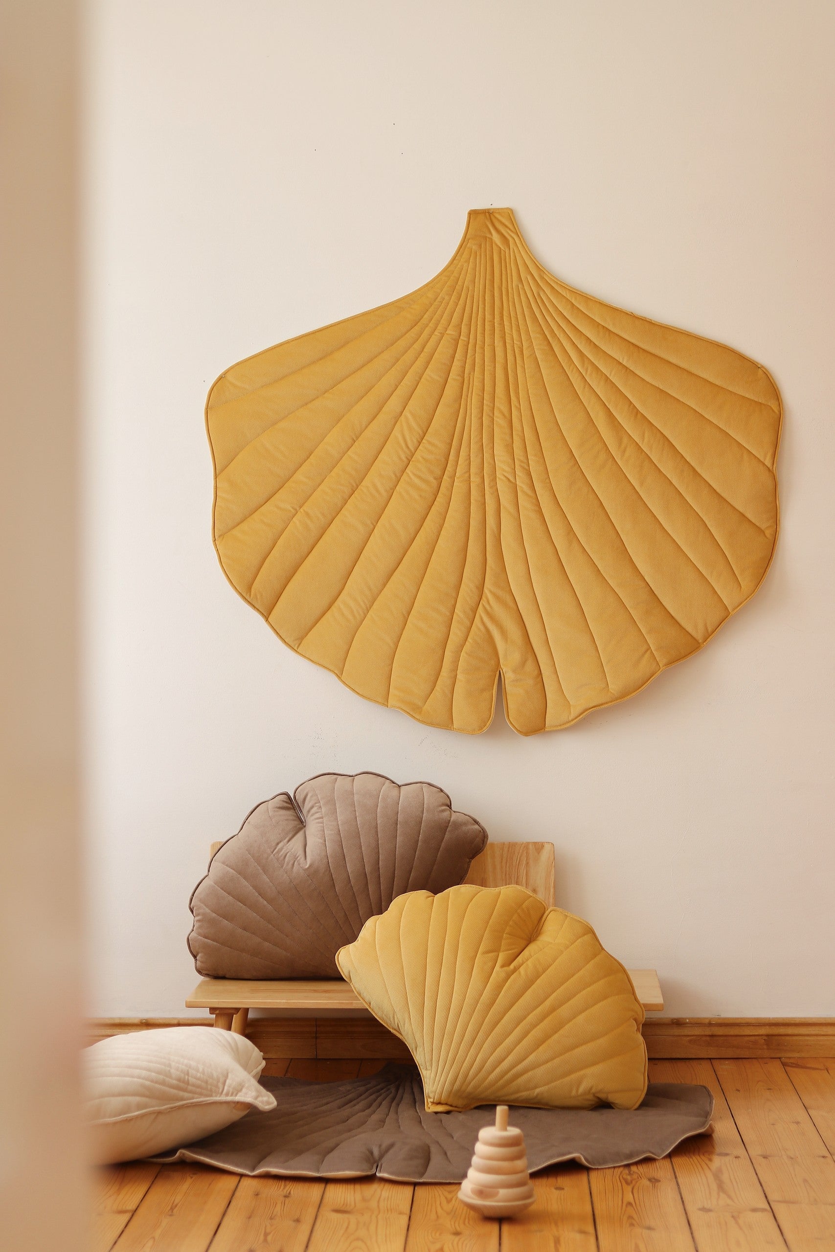 elegant yellow ginkgo leaf playmat with soft velvet texture, perfect for refined nursery or garden decor