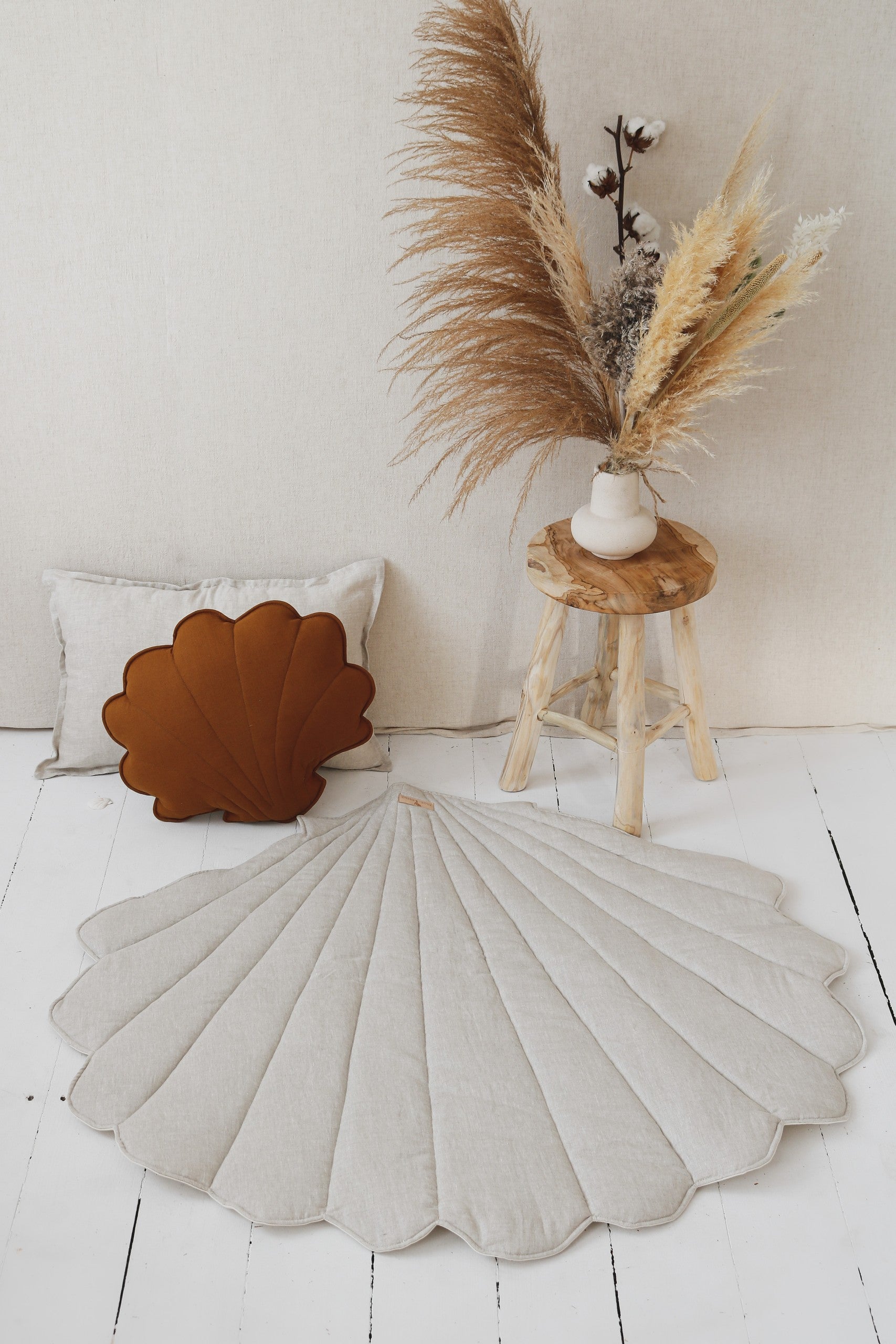 handmade ginkgo leaf playmat laid flat on floor showing practical 3cm thickness and sand color