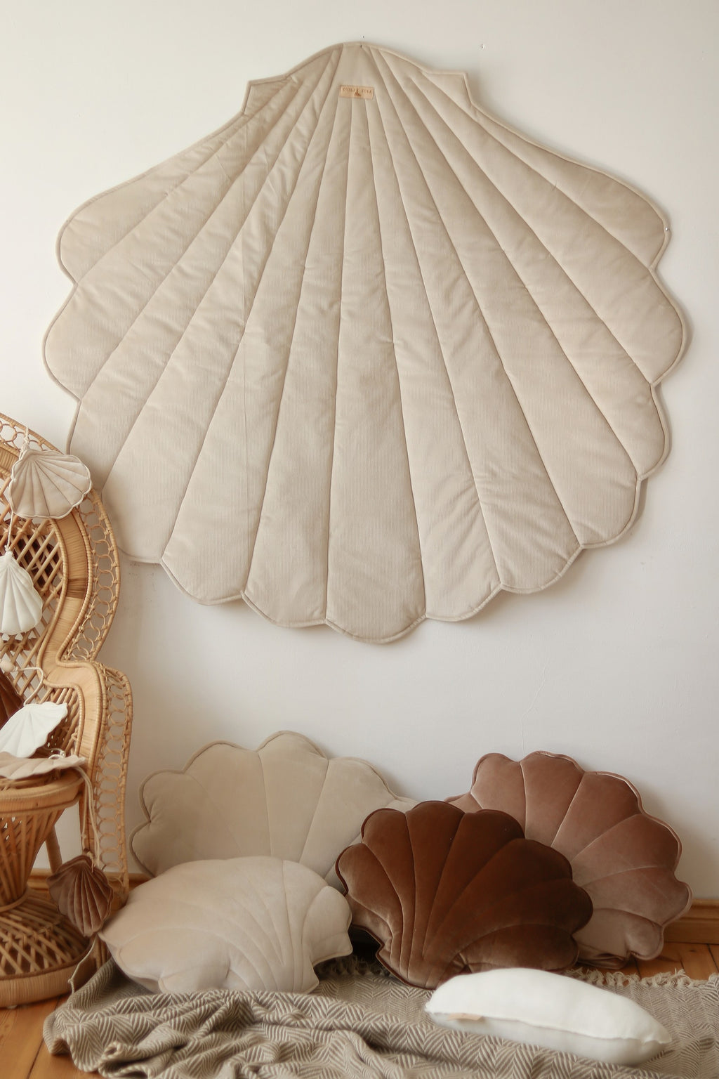 bold beige ginkgo leaf playmat in a bright studio setting showcasing its plush texture and artisan-crafted details