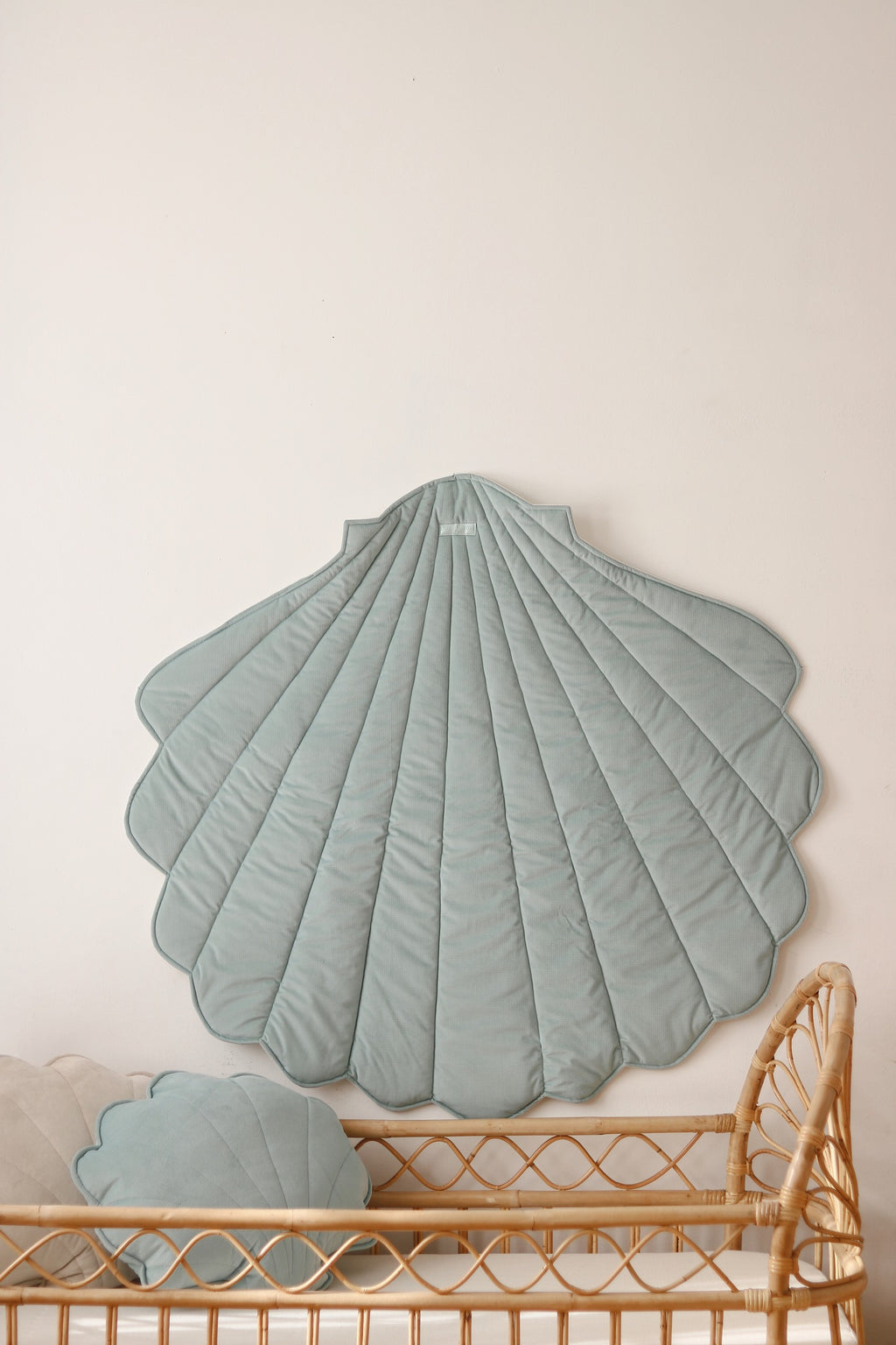 soft mint ginkgo leaf playmat on grass, cozy and inviting for picnics or playtime