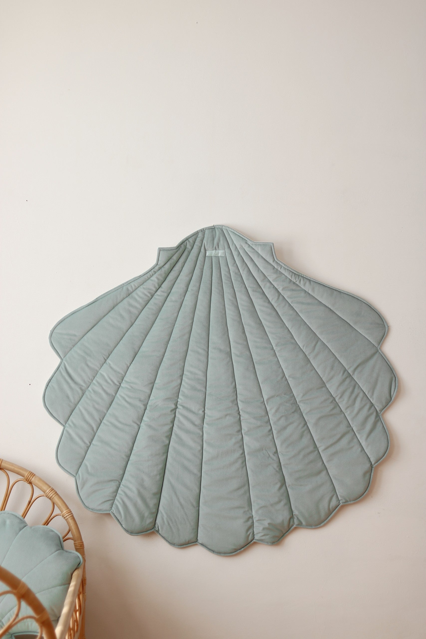 elegant mint ginkgo leaf playmat on a wooden floor, soft velvet and organic cotton texture, natural light
