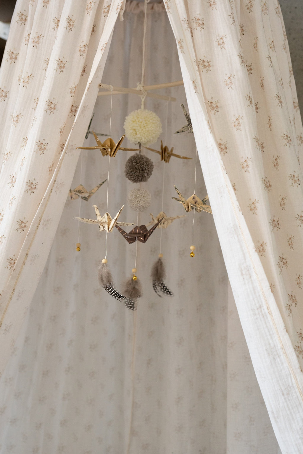 a playful boho flower cotton canopy hung over a cozy reading nook with fairy lights