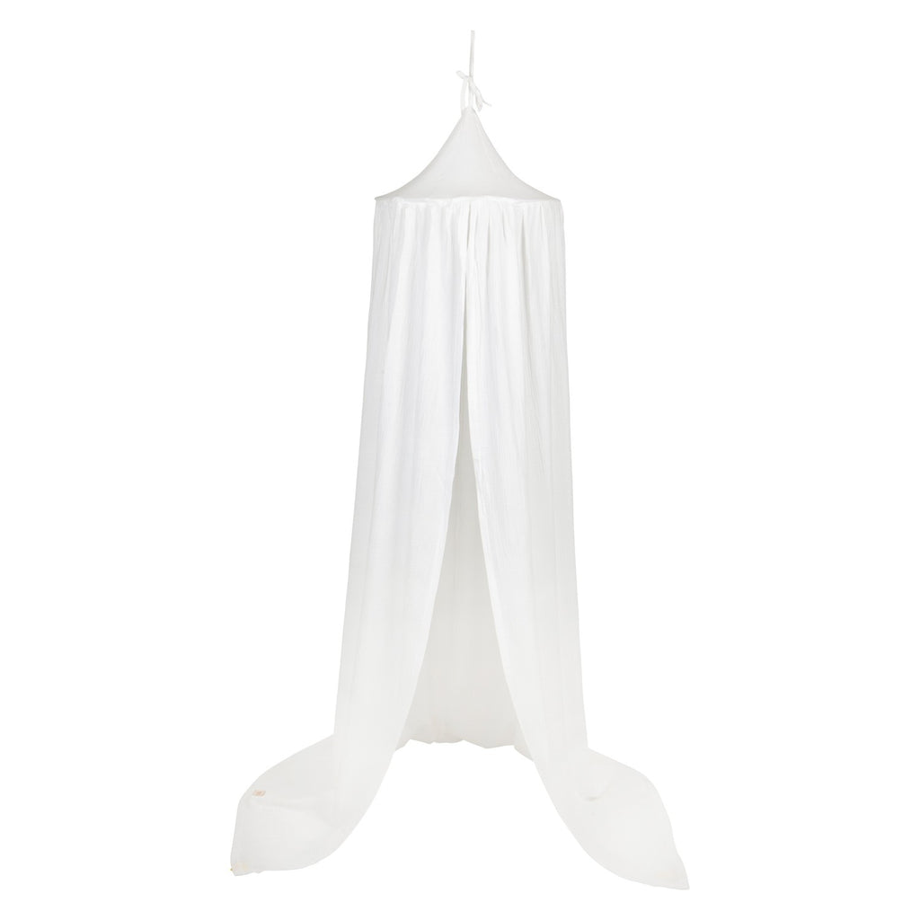 organic cotton cream canopy draped gracefully over a bed, soft light filtering through the fabric
