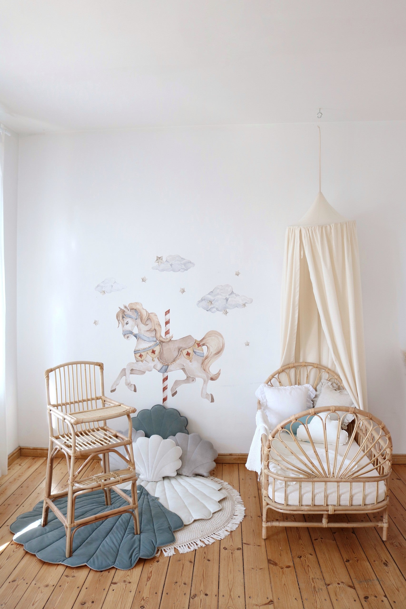 organic cotton canopy hanging over a cozy reading nook with soft natural light filtering through