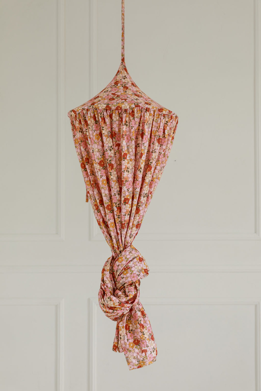 mint organic cotton canopy draped over a bed with soft morning light filtering through