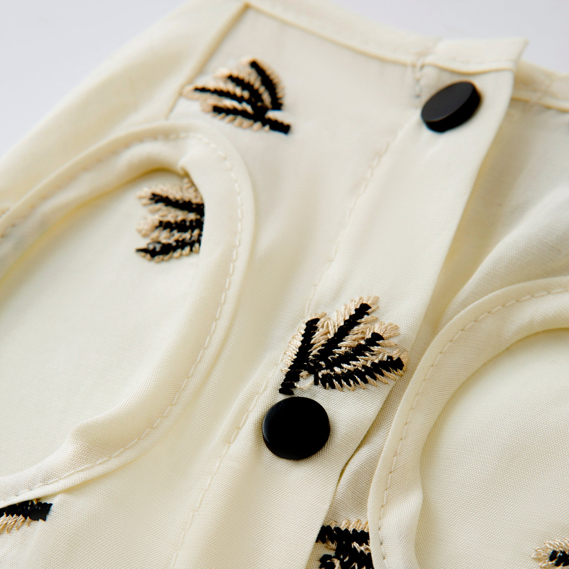 Cream Pleated Dress with Black Embroidery
