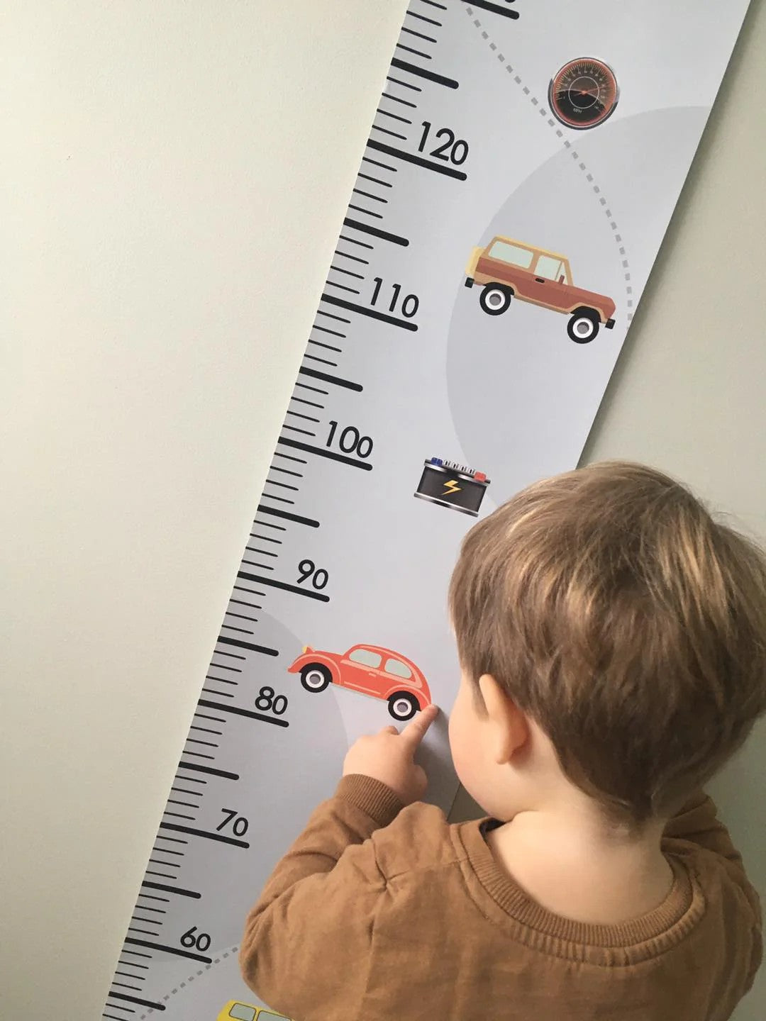bold retro car growth chart for kids on a vibrant nursery wall