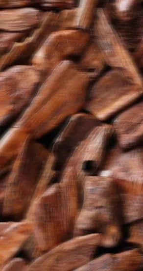 elegant close-up of incognito perfume oil bottle with amber glow on a minimalist surface