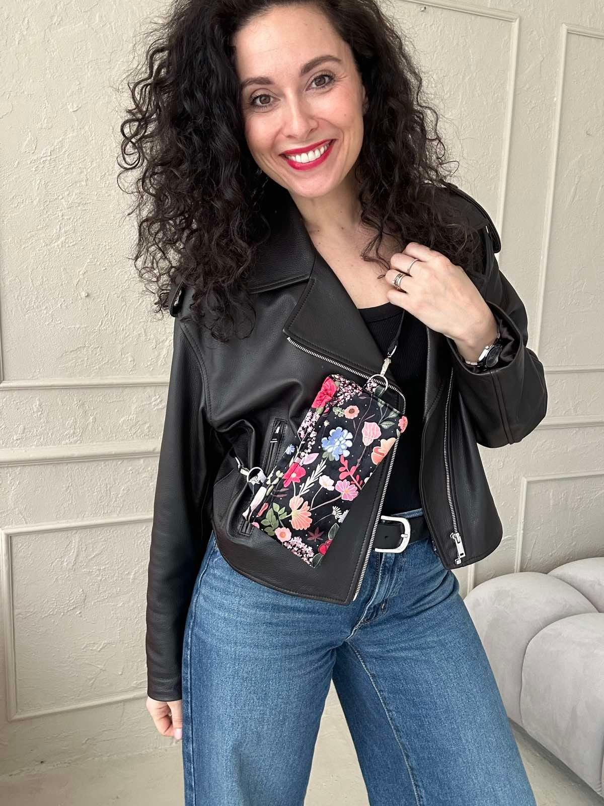 close-up of a playful curly summer night phone bag with its front zipper open