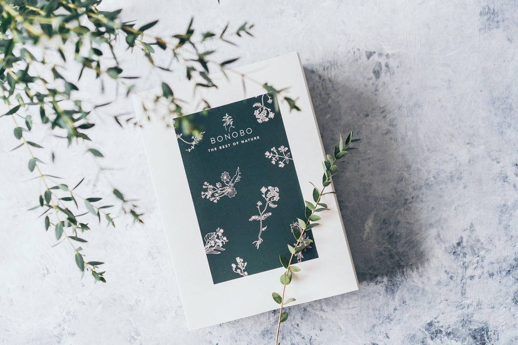 elegant gift box of four natural body scrubs open to reveal the raspberry and grapefruit scent